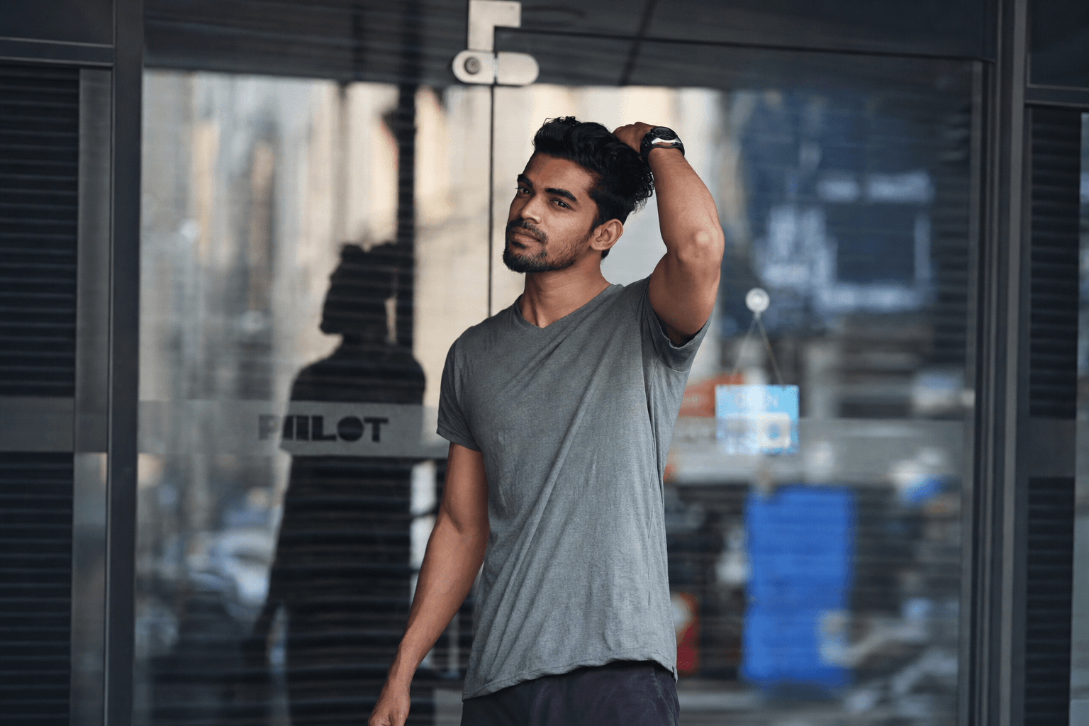 Before: supplied real man model in the original waist-up photograph wearing a grey V-neck T-shirt
